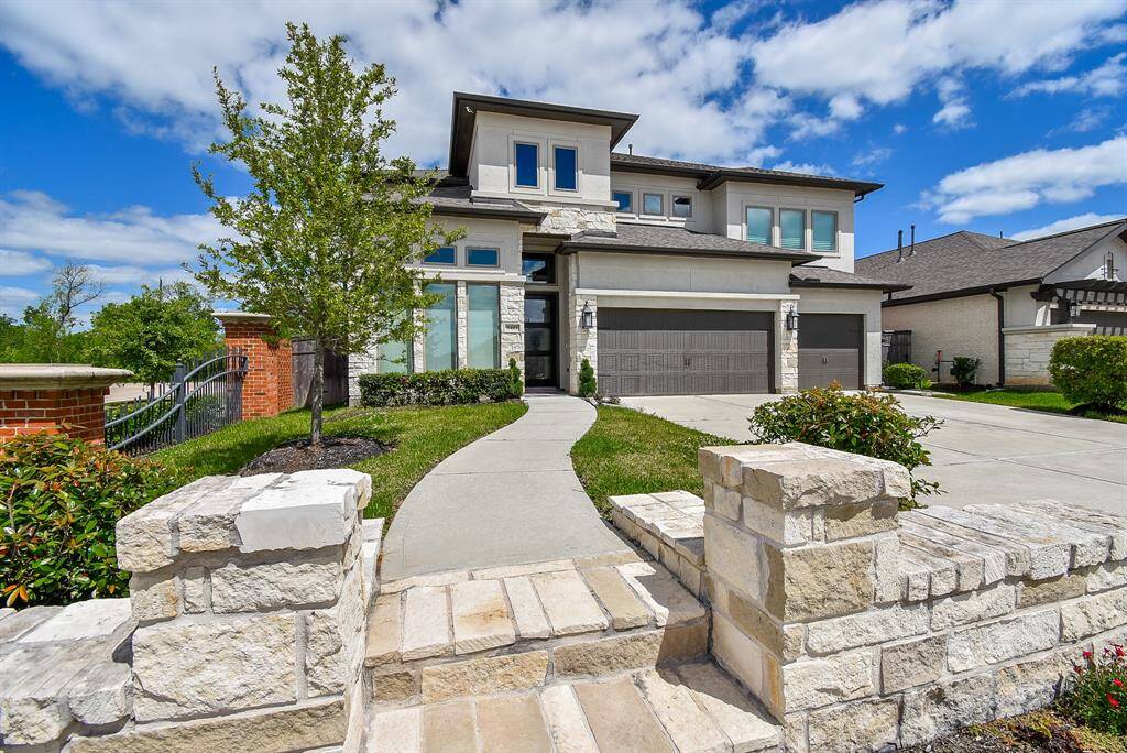 Welcome home to your beautiful landscaped garden set just beyond your stone walkway leading to the shaded front porch.