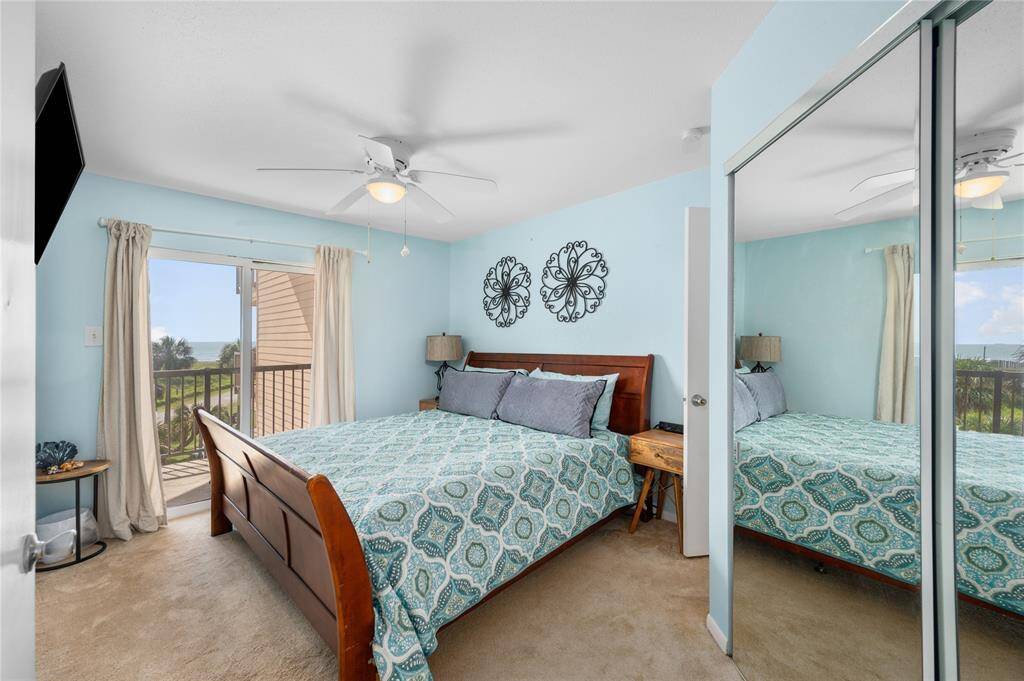 Enjoy access to the large balcony from the primary bedroom.