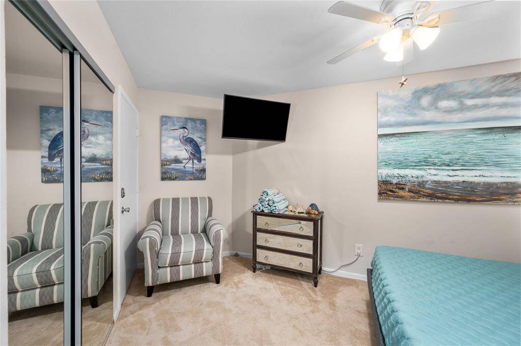 Large storage closet and comfy chair.