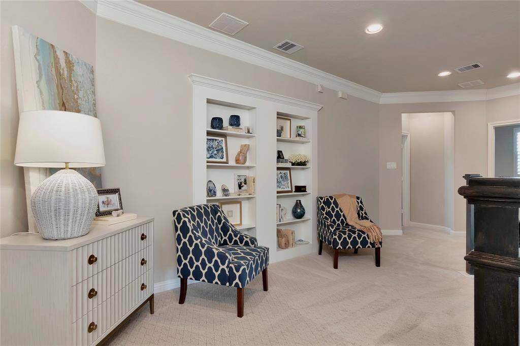 Second floor cozy space with shelve doors to the large storage.