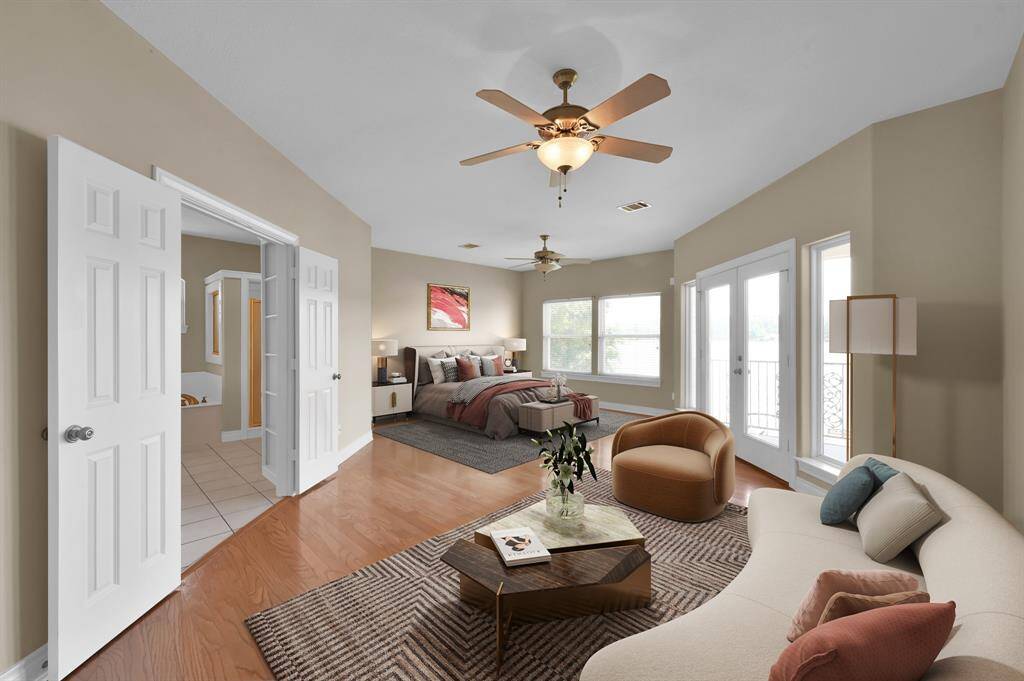 The primary bedroom is large enough to feature a sitting area