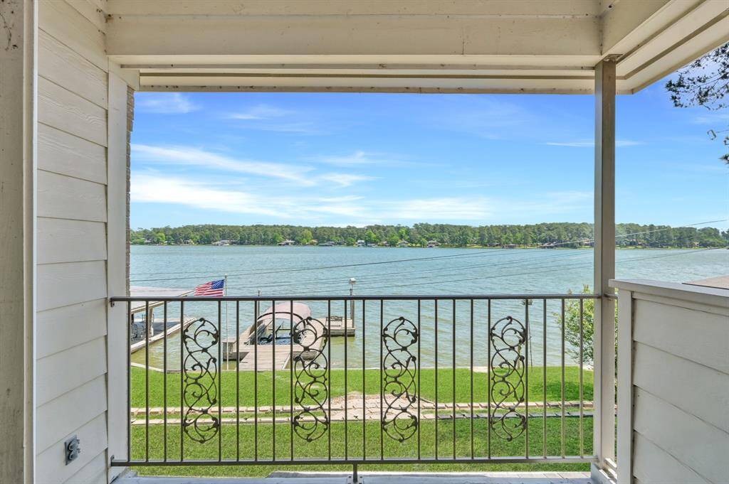 Private balcony located off the primary bedroom showcase the best of Lake Conroe living