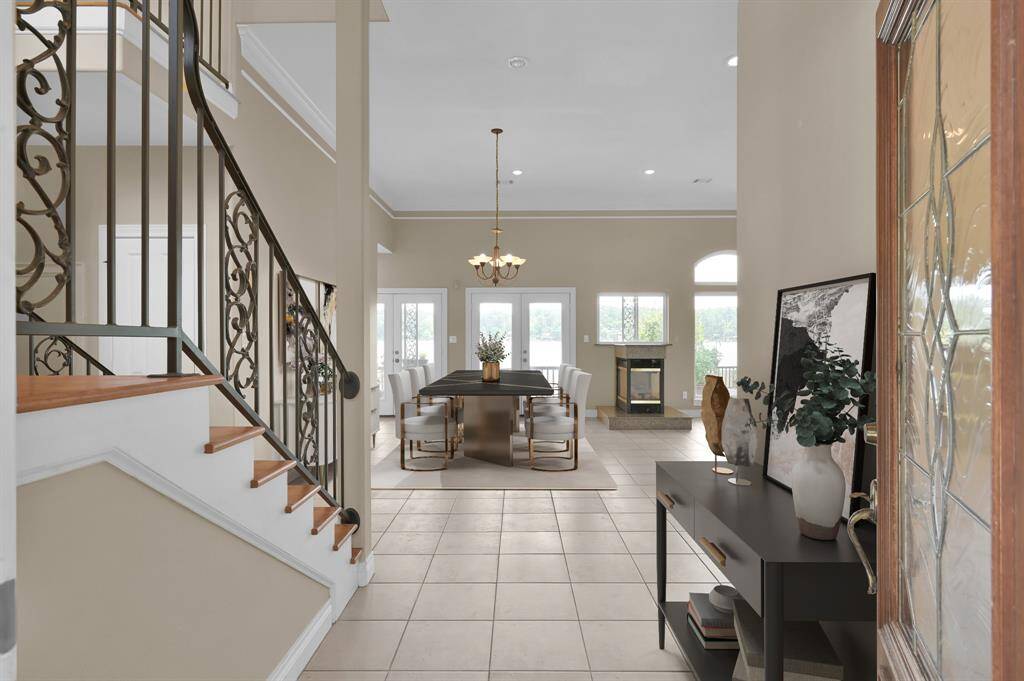 Formal entry over looking the living room where you can see directly through to the lake