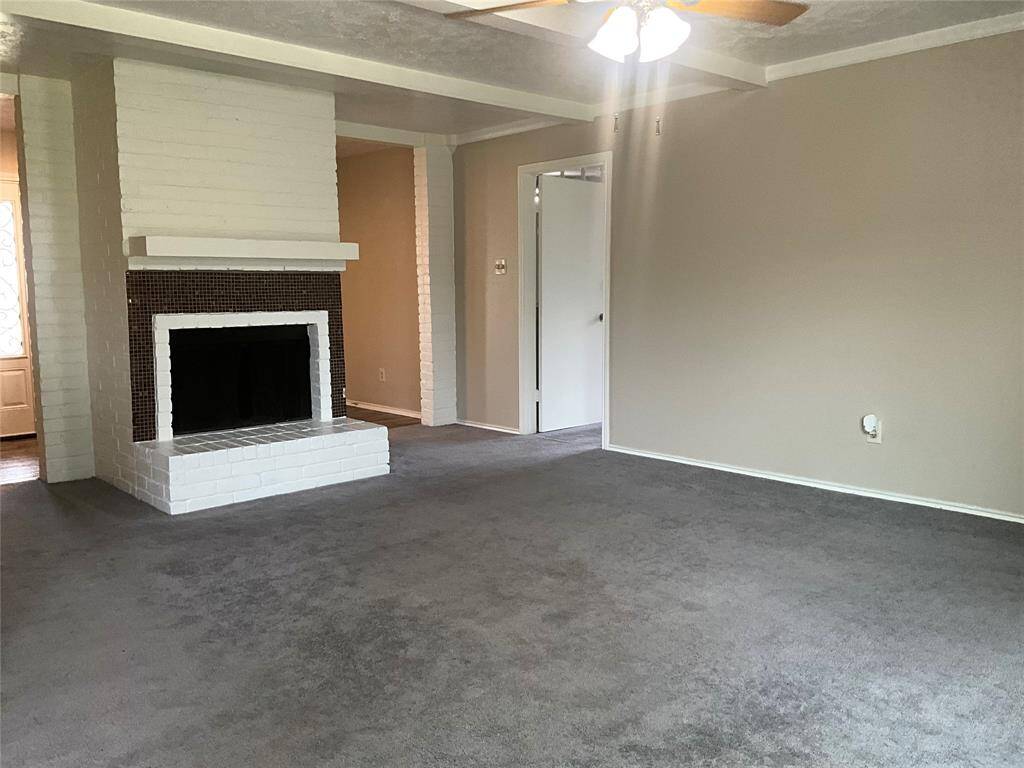 Cozy living room featuring a charming fireplace, ideal for relaxation and warmth.