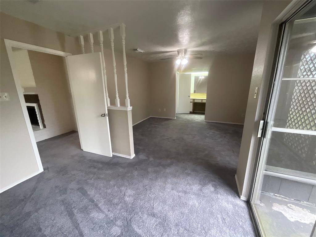 Spacious primary bedroom with a cozy sitting area, perfect for relaxation.