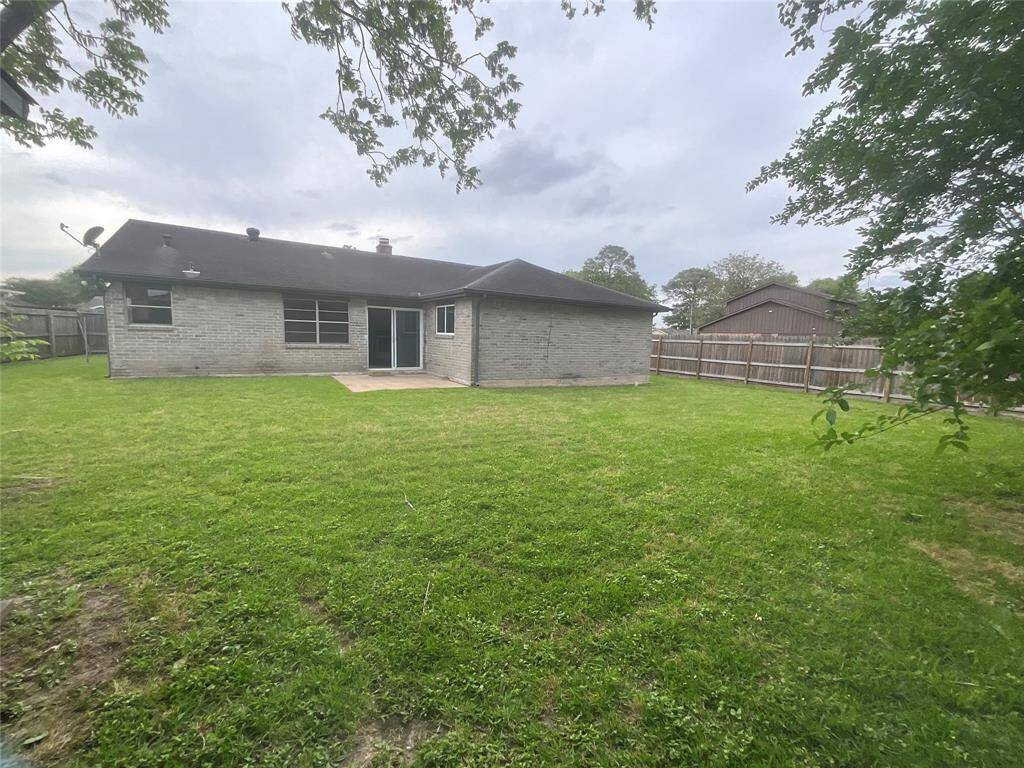 Expansive backyard ready for your dream amenities—ideal for a pool, garden, or sport court.