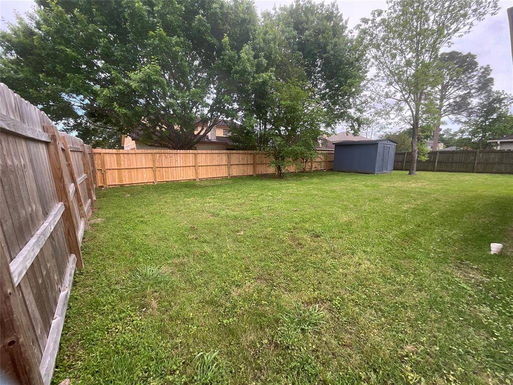 Enjoy privacy and security with a newly installed fence surrounding the yard.