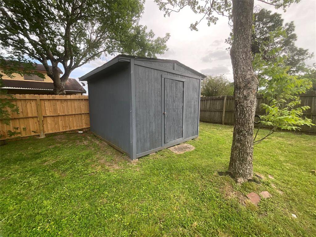 Spacious shed for secure tool storage and extra space.
