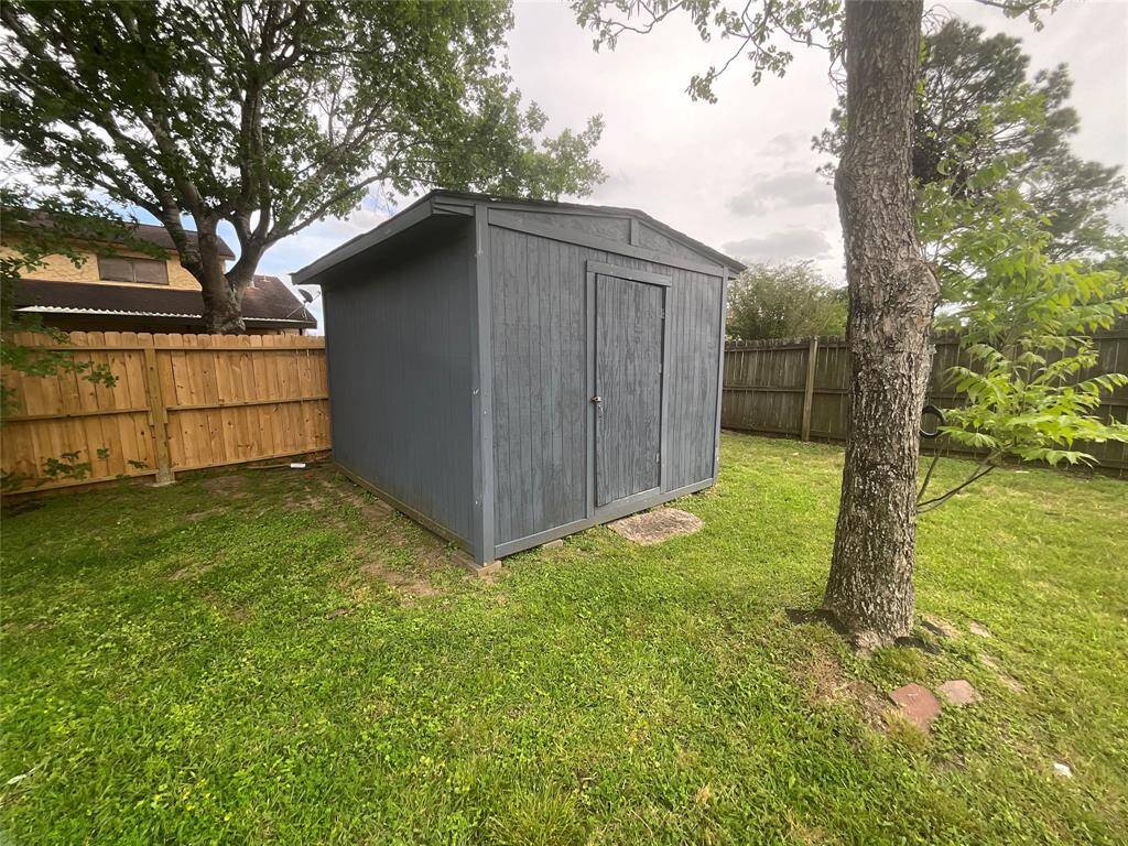 Spacious utility shed for versatile storage and organization.