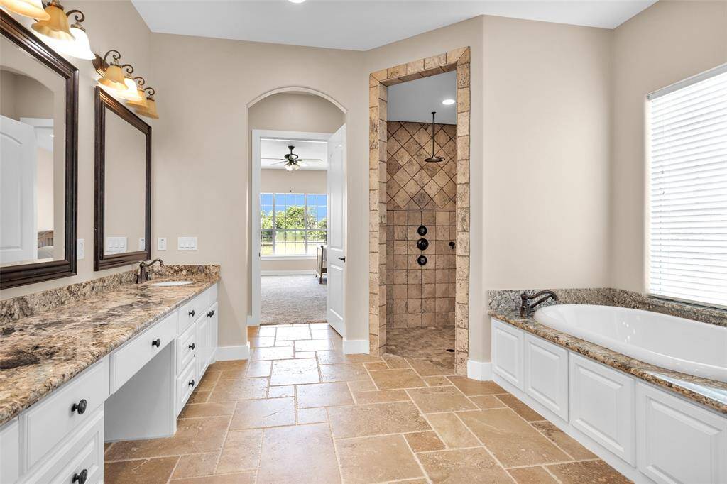 Master Bath with Dual Vanity, Travertine Tile Shower & Garden Soaking Tub