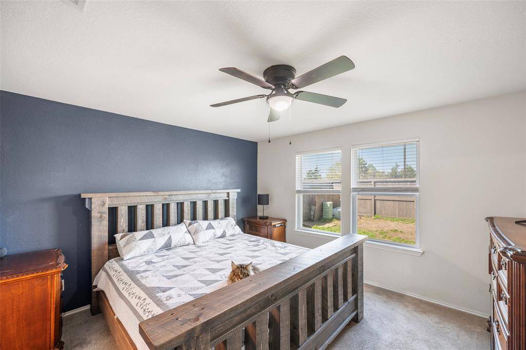 Spacious primary bedroom with high ceilings