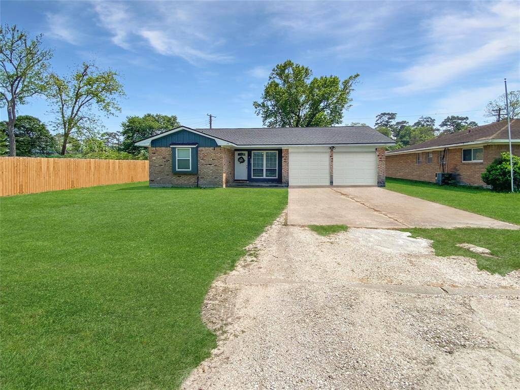 Welcome to 203 Pine Street! Enjoy additional yard space on both sides of the home, with fence gates providing access to the backyard from each side. Image digitally enhanced to show uniform fence color. Actual fence includes a combination of older and newer sections.
