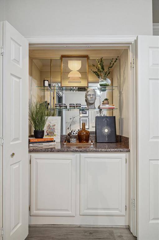 Dry bar include a set of bifold doors that can easily be removed.