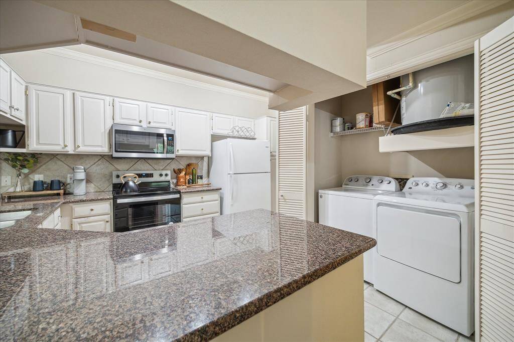 laundry closet is located in the kitchen and the water heater was replaced around 2022