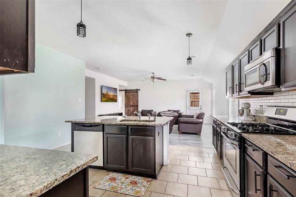 Fantastic open concept living featuring the kitchen and living room.