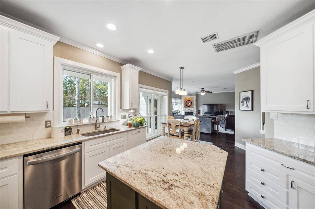 The Kitchen and oversized Den line the back of the 1st floor.