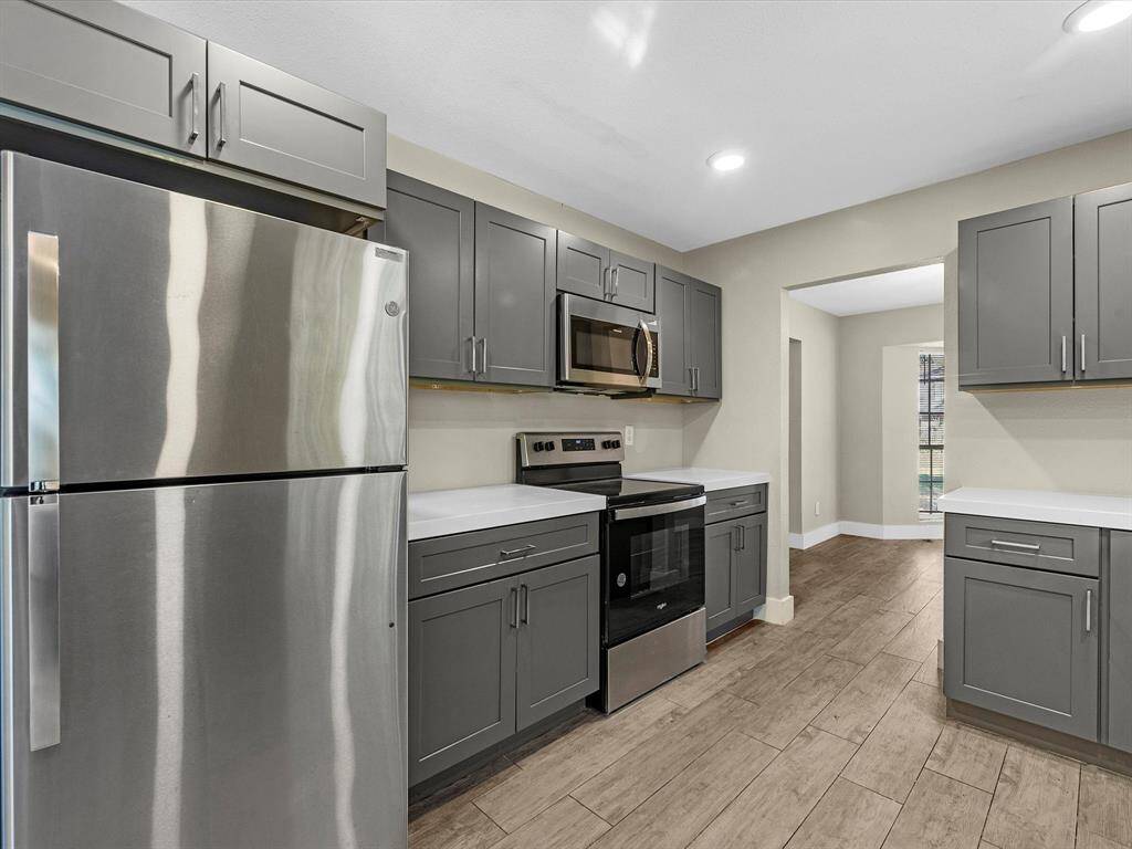 This kitchen offers plenty of cabinet space for all your storage needs.