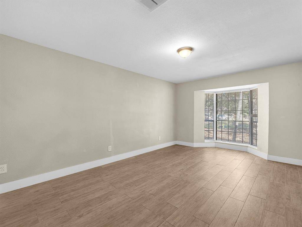 The oversized secondary front bedroom offers views of the front yard.