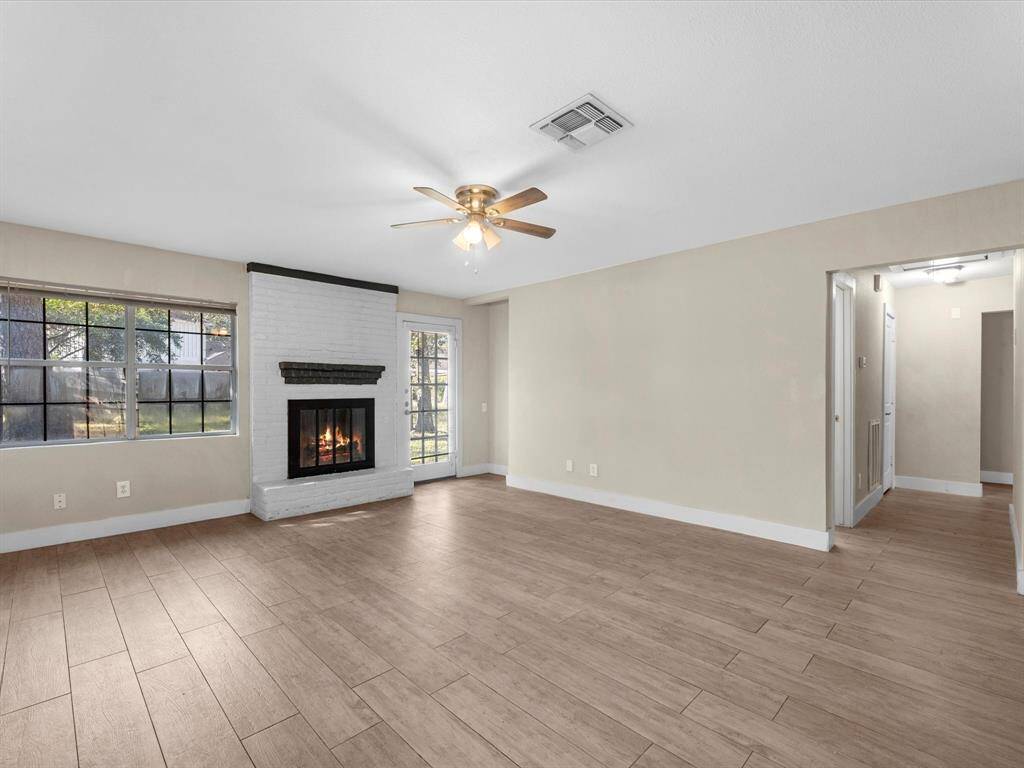 Main living room offers direct access to the backyard.