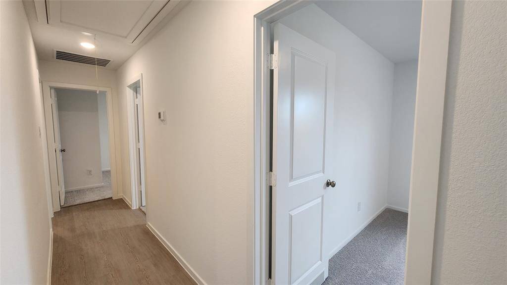 Hallway to 3 bedrooms and hallway