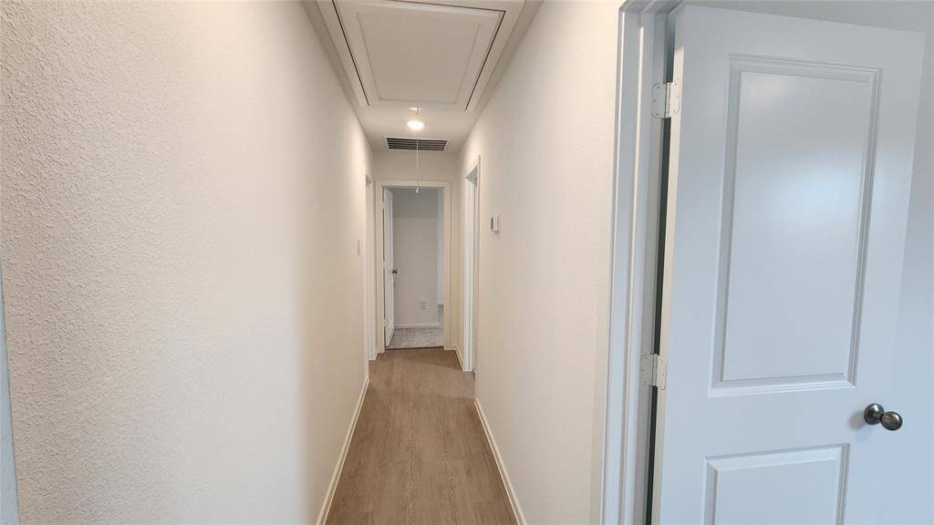 Hallway to 3 bedrooms and hallway