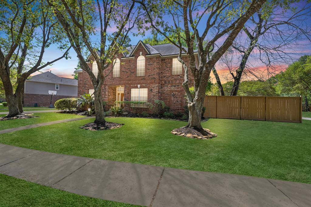 Welcome home to this stunning brick residence, nestled among mature trees with a beautifully landscaped yard. Experience tranquility and elegance in your own private oasis.