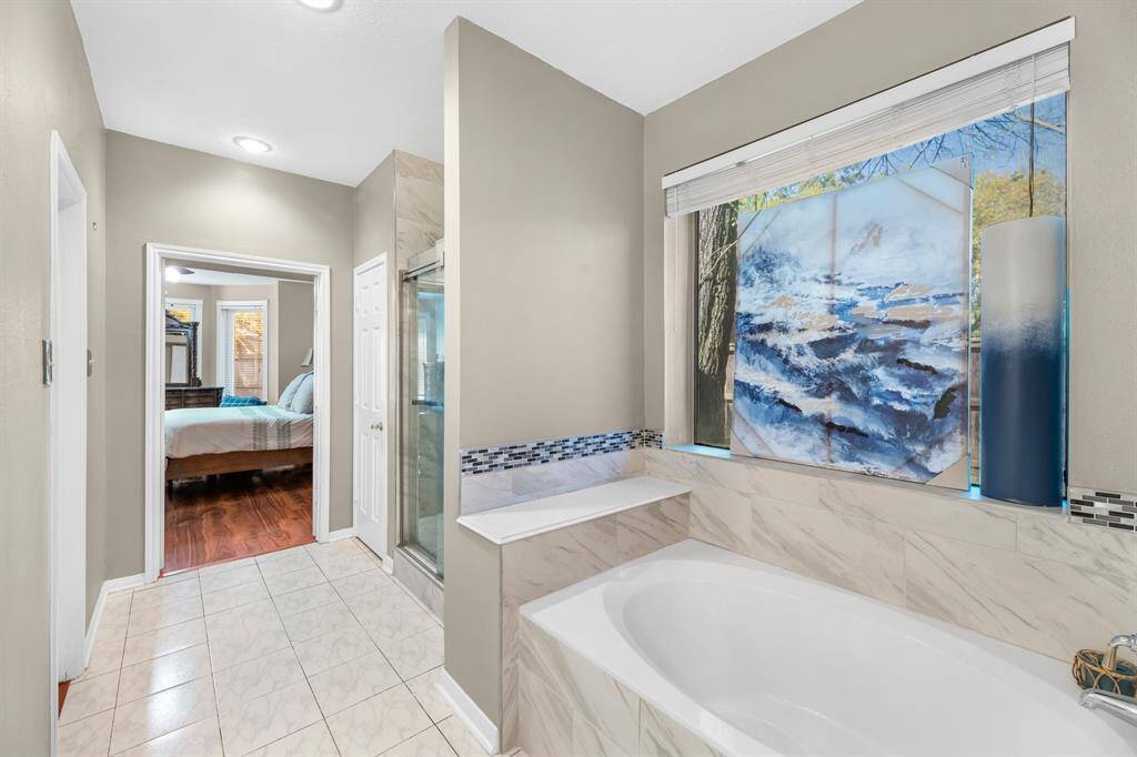 Experience the perfect blend of comfort and elegance in this inviting space, featuring a luxurious bathroom and a cozy bedroom retreat.