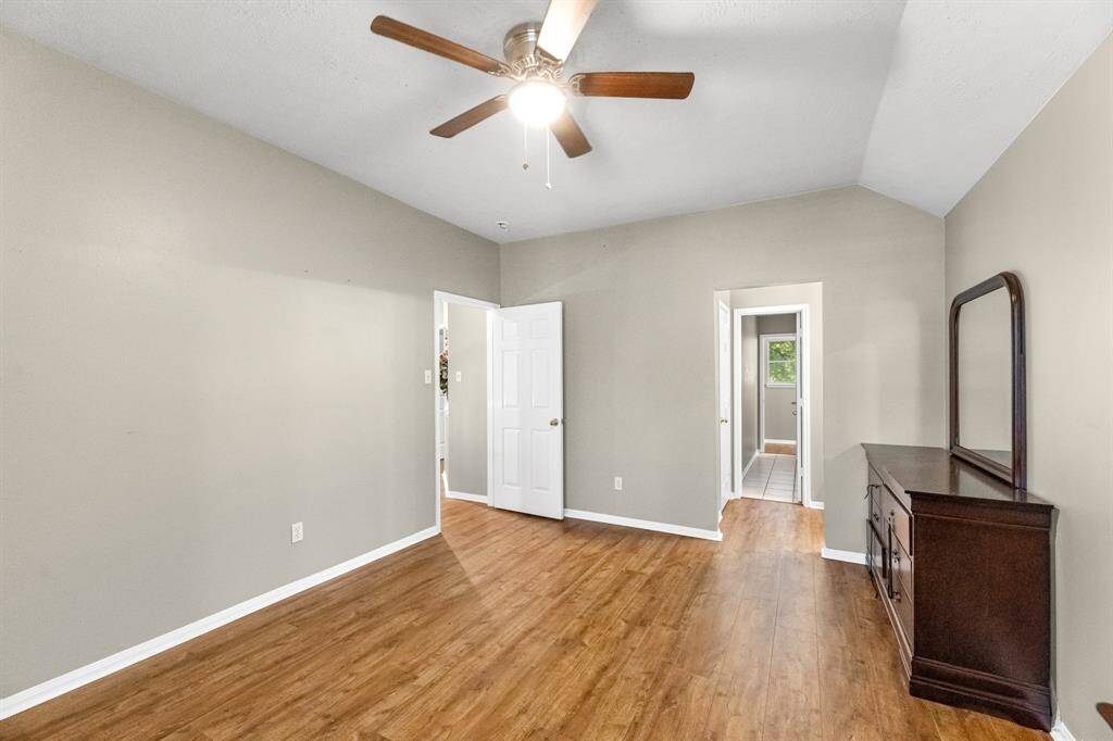 Experience the comfort of this bright, spacious room, featuring elegant hardwood floors and a ceiling fan for perfect climate control. Your new sanctuary awaits.