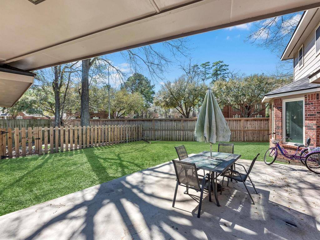 Imagine relaxing in this serene backyard oasis, perfect for outdoor dining and entertaining.