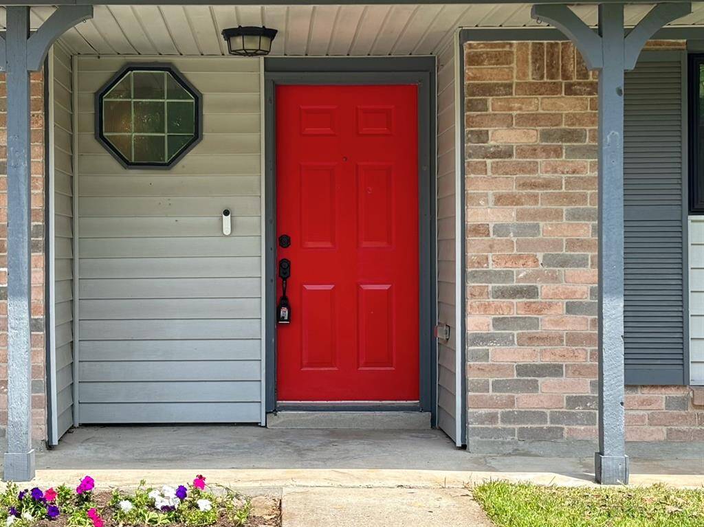 The freshly painted red front door offers a warm and inviting welcome to what could be your next home. More than just a stylish upgrade, red is often associated with positive energy and a sense of protection—setting the tone for a space filled with comfort, joy, and new beginnings.