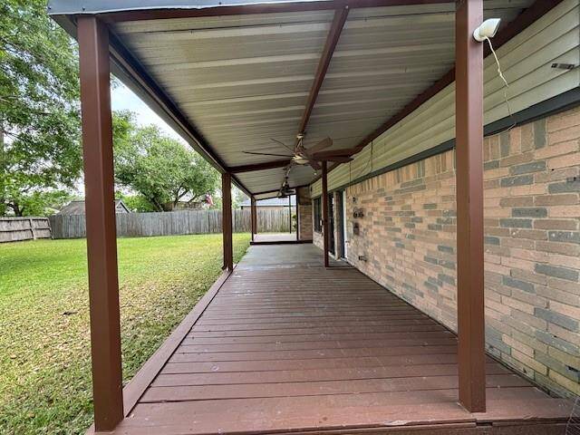 Covered backyard patio with fans