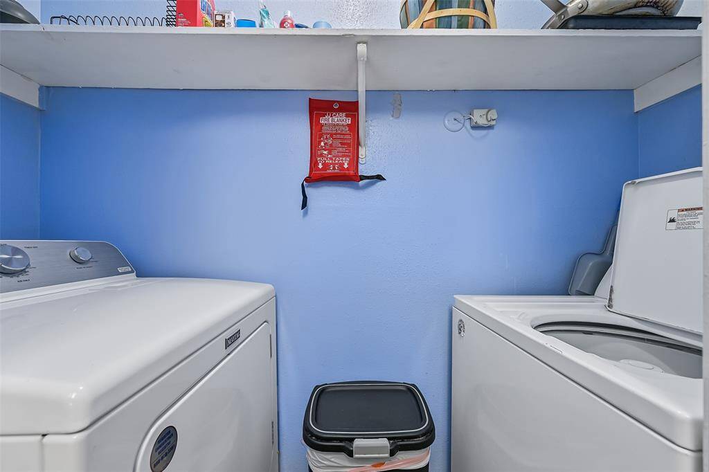 Accessed from the kitchen is the utility room, which features a newer full size washer & dryer. No stackable units here!