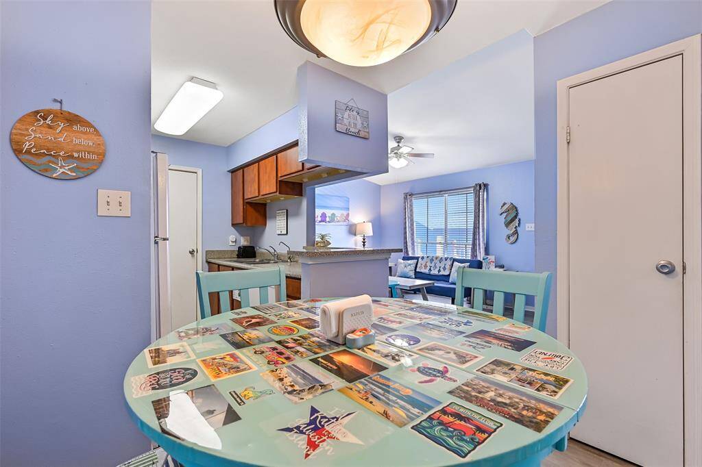 Check out the fun, custom, kitschy dining table (it is able to be expanded with a leaf for additional dining space).