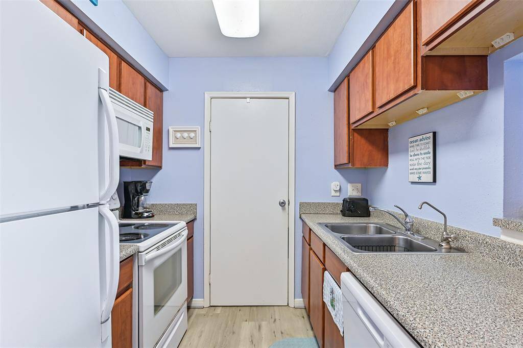 Updated with newer white appliances and plenty of counter space.