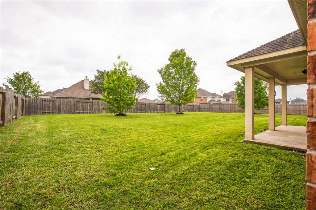 Extended covered patio with dual fans.