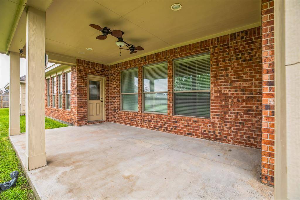 Extended covered patio with dual fans.