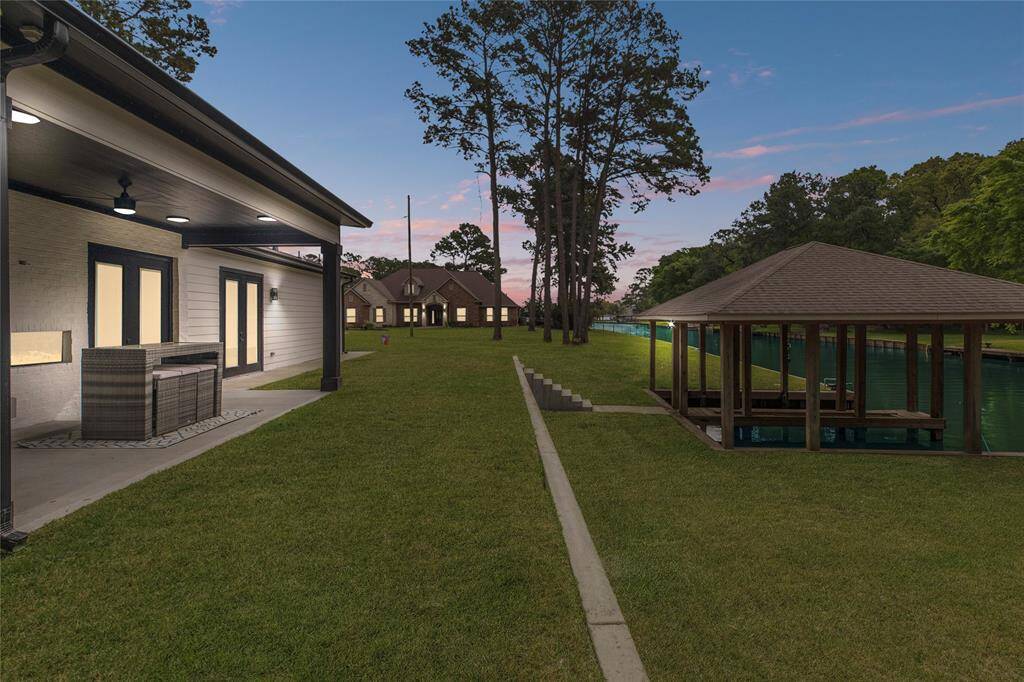 Large back patio with a fireplace (no furniture)