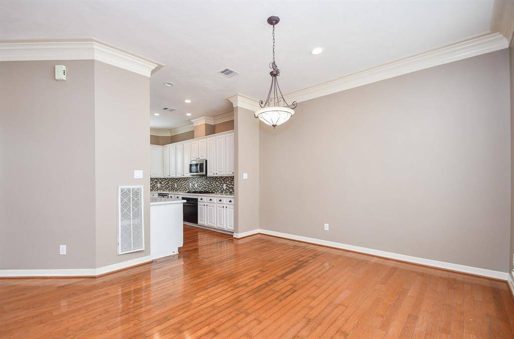 This amazing dining area invites sizeable pieces and favorite accents,too!