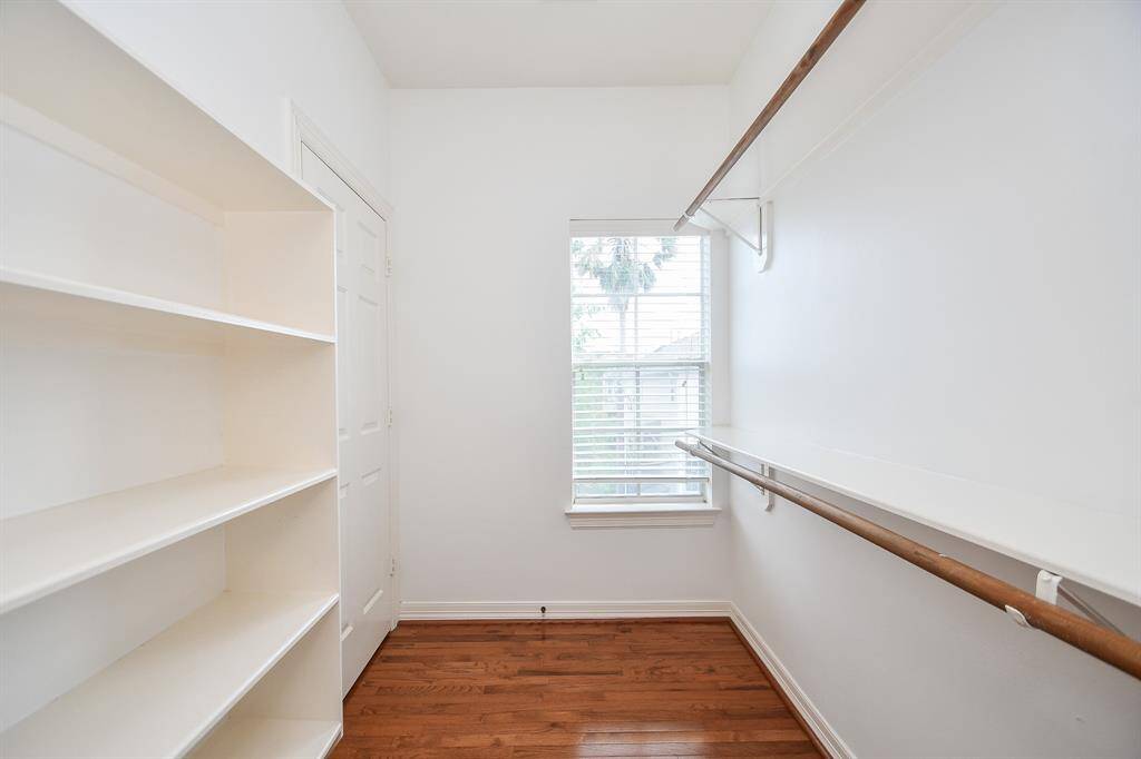 Wow! This amazing primary walk-in closet will store and organize everything you own in one sunny space.