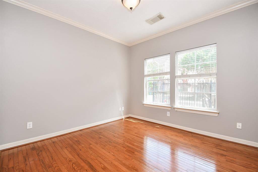 Nice big double windows brighten this secondary bedroom.