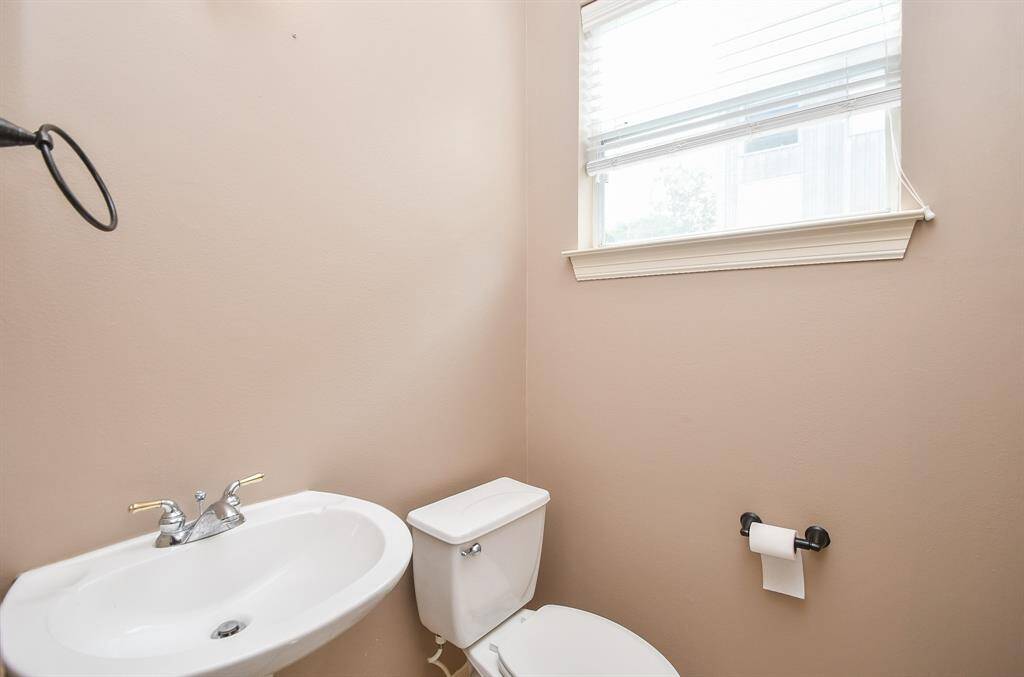 Even the half bath has relaxing personality with another welcomed window.