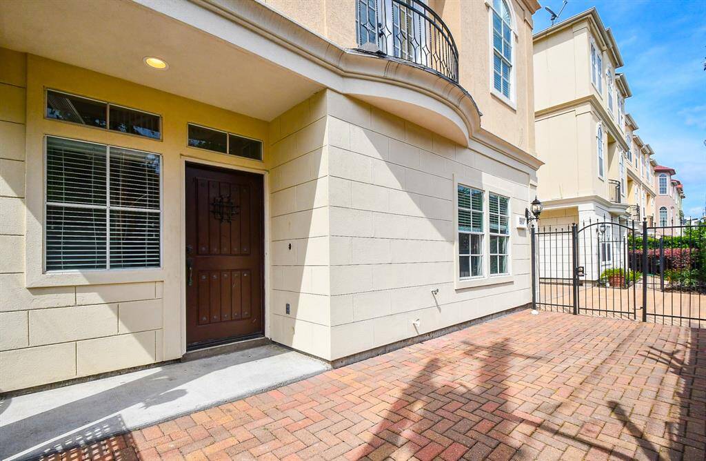 Your covered entrance sits just off a court yard-like setting.