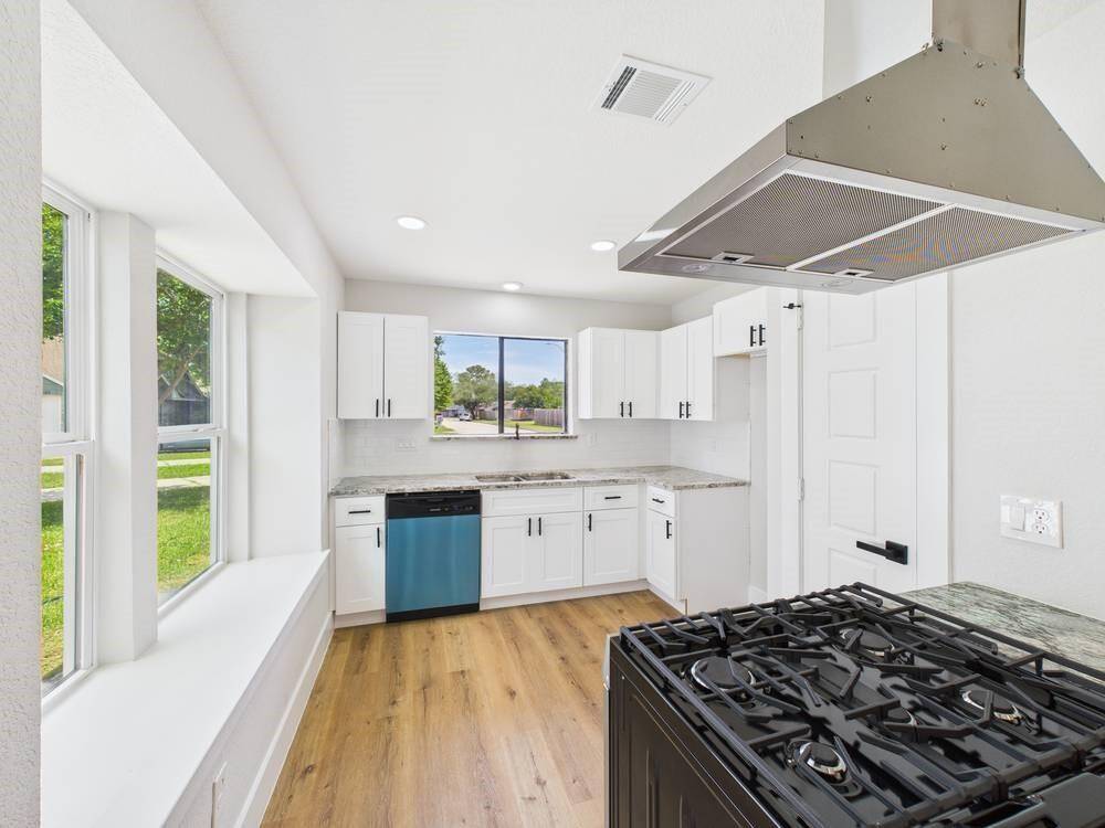 Your bright and airy kitchen featuring NEW appliances and top of the line finishes!