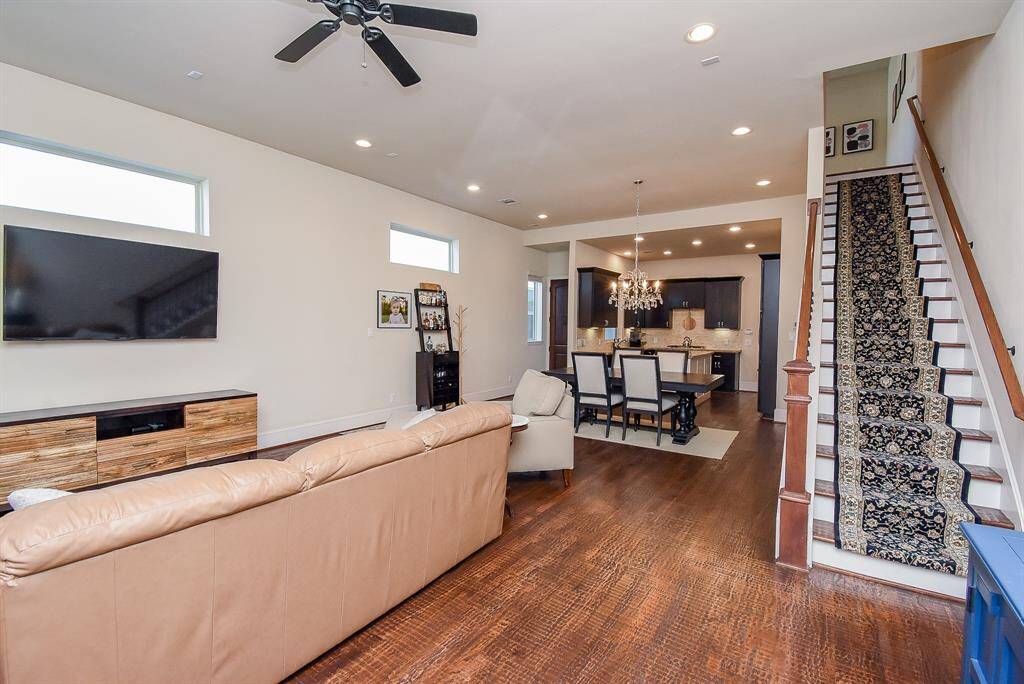 The lovely placement of the staircase is convenient to and from common areas.