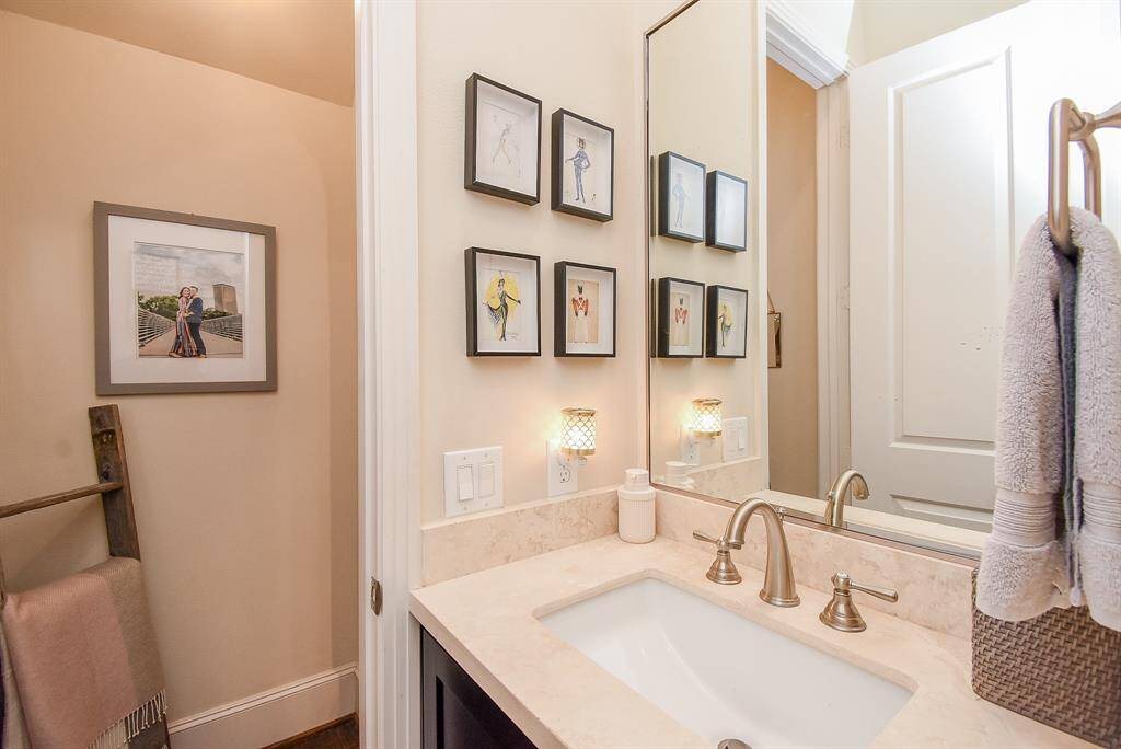 Pale peachy-beige walls and counter add a warm personal vibe in this bath.