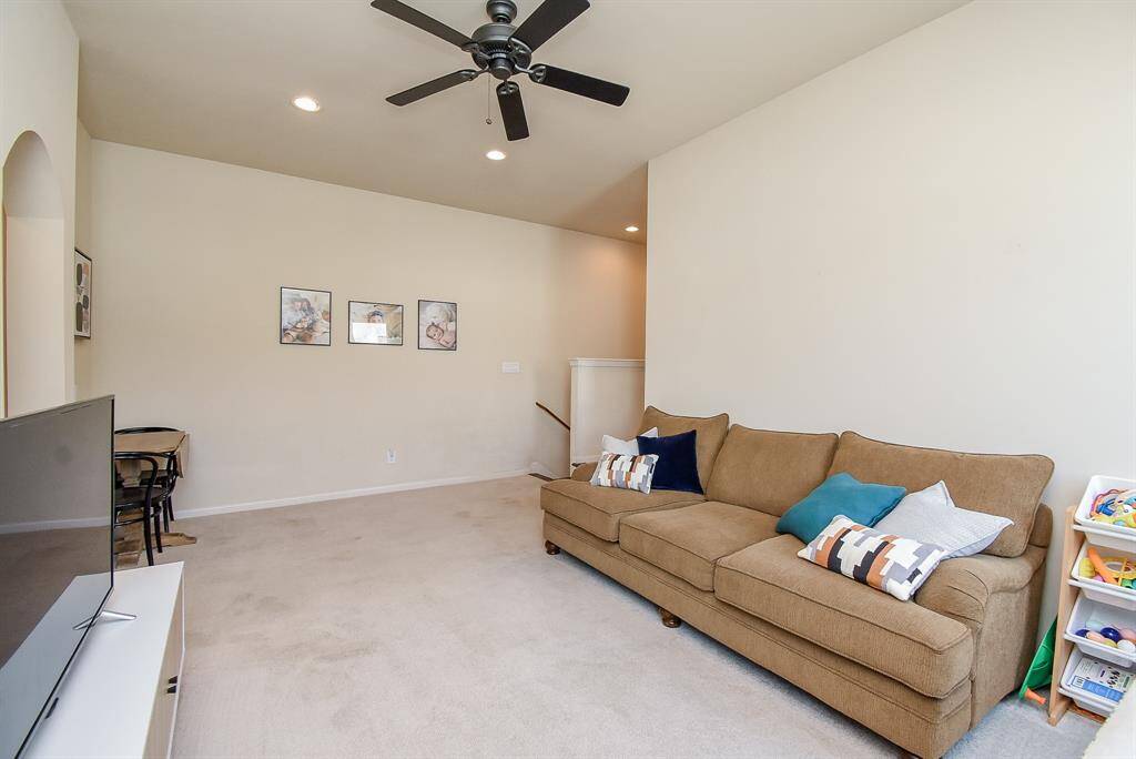 Here we are on the carpeted, upstairs landing to the "game room" or alternate living space; whivh offers high ceiling, tremendous wall/floor space for media/entertaining gear.
