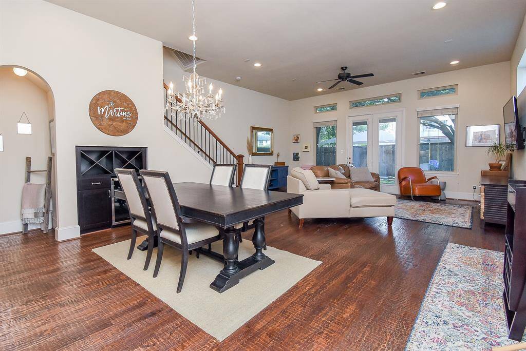 A great high ceiling embraces the wall of windows and clear patio doors that overlook the patio and backyard. There are plenty of wall and floor space, for all your treasures.