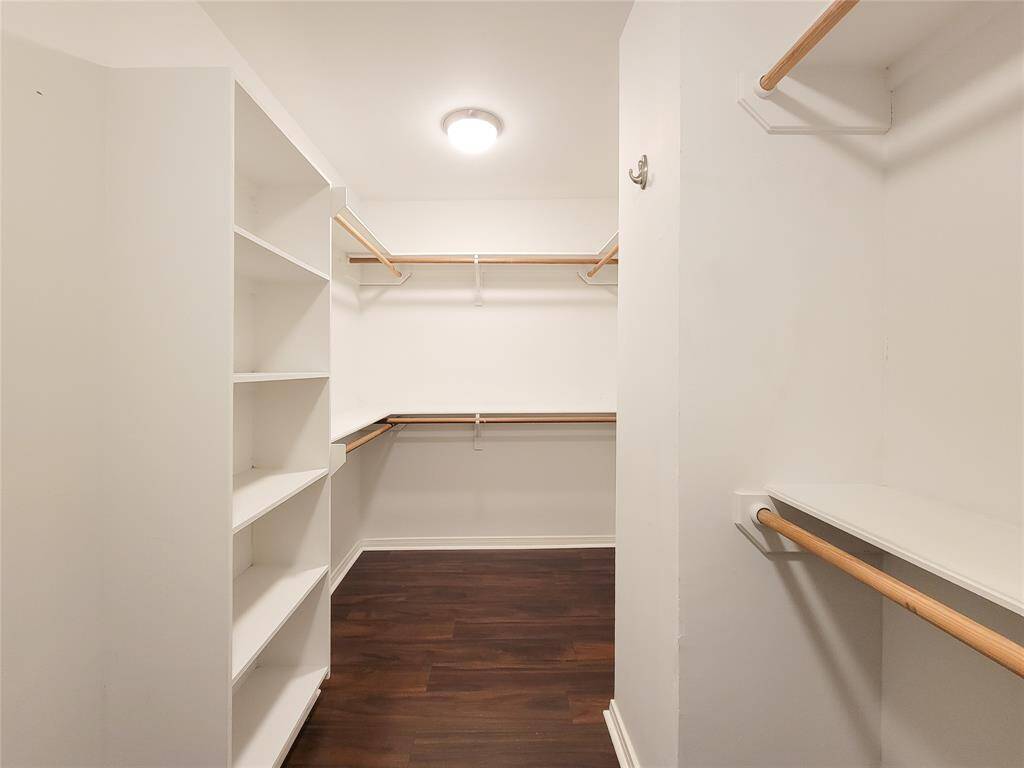 Spacious primary closet with plenty of room for all your storage needs
