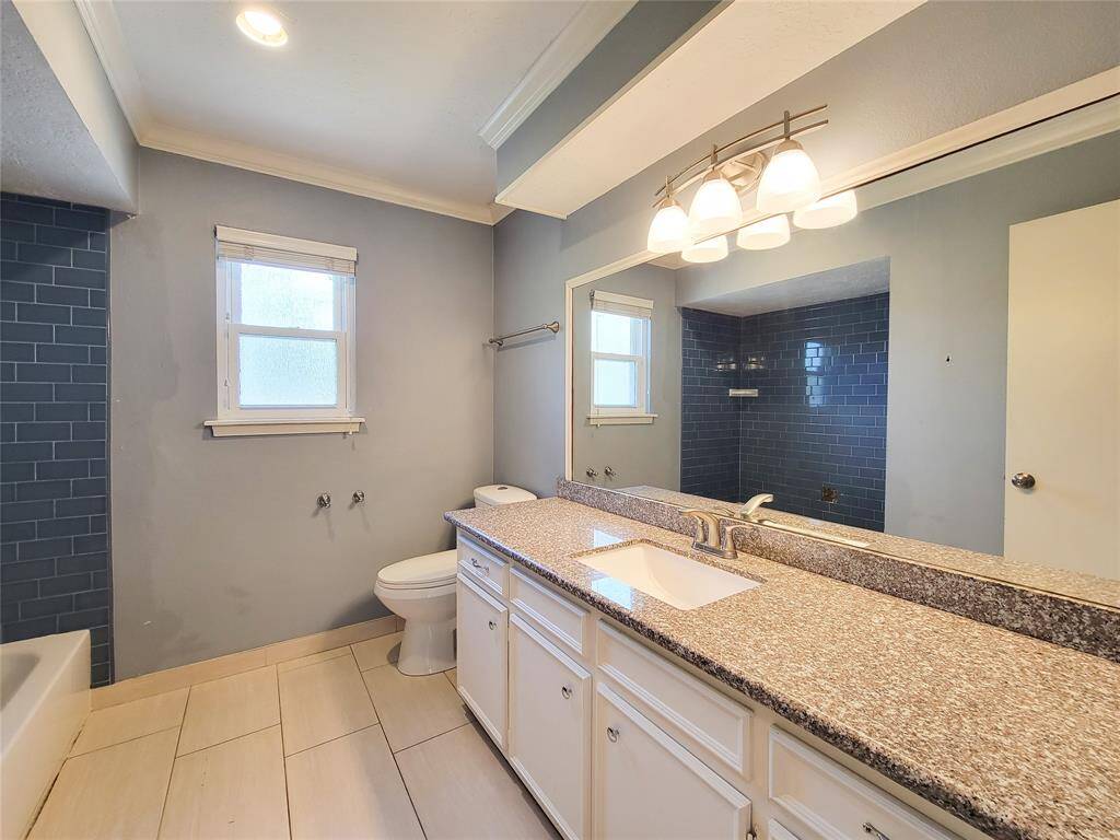 Updated bathroom conveniently located in the hall, serving all three bedrooms