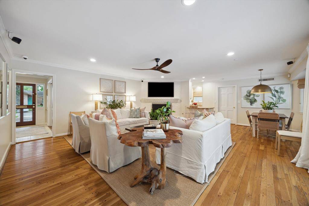 Another view of the family room. To the left is the entry way and front door. To the right you can see the breakfast area located off the kitchen and adjacent to another large bay window.